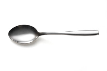 The metal shiny spoon isolated on white - obrazy, fototapety, plakaty