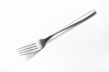 The metal shiny fork on white