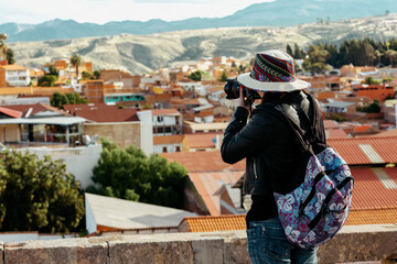 Fototapeta na wymiar A tourist photographs the city of Sucre. Bolivia. 