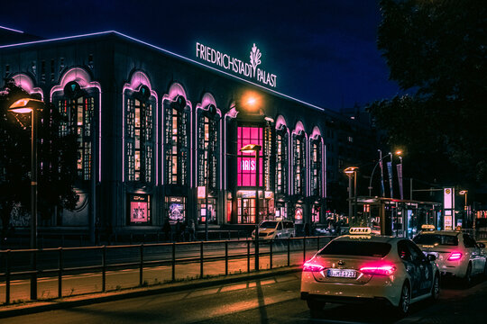 Berlin, Germany 2022: Friedrichstadtpalast Friedrich Palace during night with colorful neon lights and illumination scenery