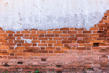 Red white wall background. Old grungy horizontal masonry texture. Brickwall structure backdrop with broken stucco and plaster.