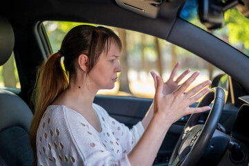 Fototapeta na wymiar woman resent driving after a car accident. woman driving a car.