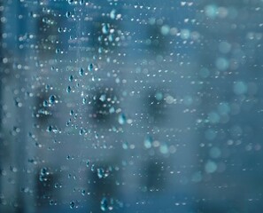 Raindrops on window. Wet window glass. Sad rainy day. 