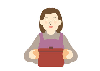 赤い鋳物の鍋を持って笑う女性