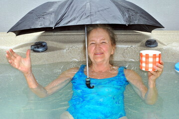 Mature female senior enjoying her hot tub at home.