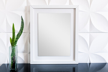 Stylish mirror on textured wall. Modern classic interior design.