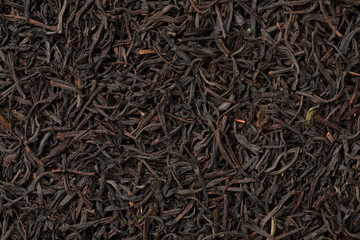 Dried Ceylon blend tea leaves full frame close up as background 