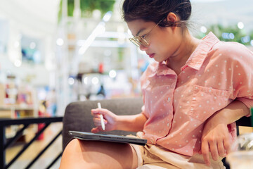 relax leisure attractive smart asian female freelance entrepreneur smile and enjoy working with smartphone and laptop tablet at cafe restaurant digital nomad expat casual ideas work anywhere concept