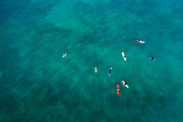 Aerial view of  Surfers in a line up waiting the next set of waves
