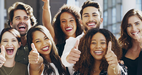 Cropped shot of a group of businesspeople giving thumbs up while standing in their office