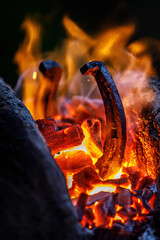 Horseshoe production process. Horseshoe in flames.