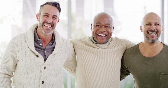 Three diverse men standing together in unity while smiling, laughing and showing strength in their bond. Biracial group of friends expressing excitement, success and victory against bright copyspace
