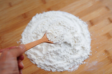 Flour in a wooden spoon