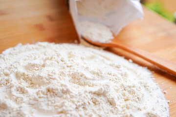 flour on a wooden spoon 