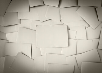 Pile of old scattered photos backside