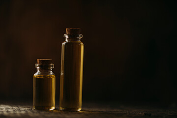 oil and flowers. Oil bottle. Spa concept. Spa. Glass. Wellness. Cosmetic. Photo. Background. Flowers. 