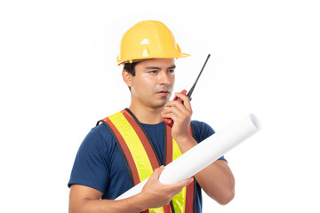 Construction handsome man worker in yellow helmet and reflective vest and using walkie talkie for talking with team staff isolated on white background.