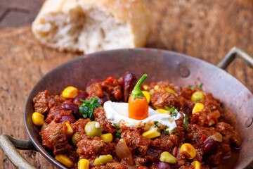 chili con carne on wood