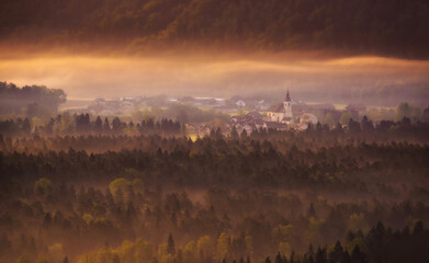 Fototapeta premium View of the countryside from Smlednik castle on a foggy morning