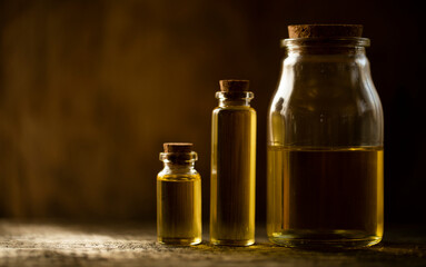 bottle of oil with flowers. Oil bottle. Glass. Nature. Beauty. Spa concept. Essential. 