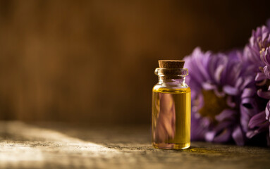 bottle of oil with flowers. Oil bottle. Glass. Nature. Beauty. Spa concept. Essential. 