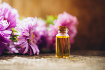 Aroma. Oil bottle. Wooden table. 