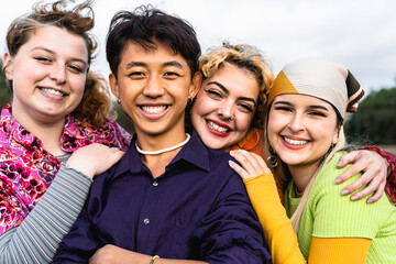 Happy young diverse friends having fun hanging out together - Youth people millennial generation...