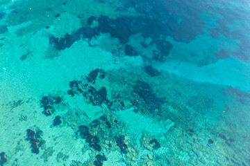 Ocean sea water surface, turquoise blue color background, aerial view. Aegean Mediterranean Sea