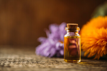Oil bottle. Spa concept. Oil. Wellness. Wooden table. Aroma. Background
