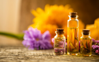 Oil bottle. Spa concept. Oil. Wellness. Wooden table. Aroma. Background
