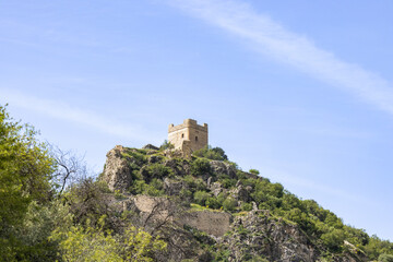 Fototapeta na wymiar Tower of the Tribute of the Castle of Zahara de la Sierra in Cadiz, Andalusia, Spain