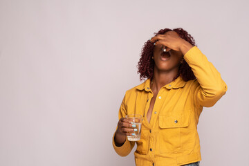 black girl taking her medication