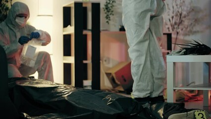 Forensic experts collecting evidence at crime scene for murder investigation