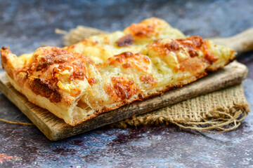   Italian  Focaccia  four cheese with crispy crust   Full 72 hour pizza dough   fermentation   method. Roman style pizza slice 