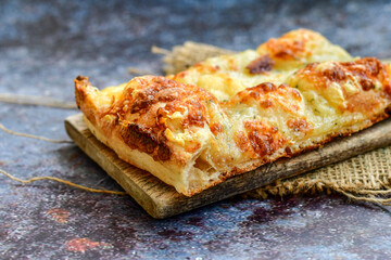   Italian  Focaccia  four cheese with crispy crust   Full 72 hour pizza dough   fermentation   method. Roman style pizza slice 