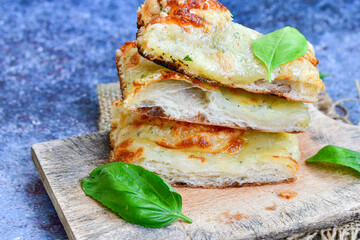   Italian  Focaccia  four cheese with crispy crust   Full 72 hour pizza dough   fermentation   method. Roman style pizza slice 