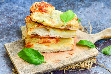   Italian  Focaccia  four cheese with crispy crust   Full 72 hour pizza dough   fermentation   method. Roman style pizza slice 