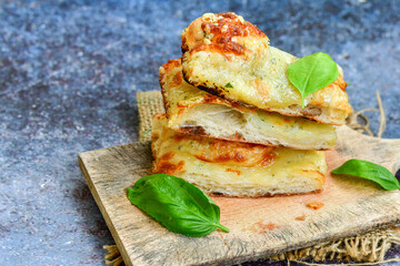   Italian  Focaccia  four cheese with crispy crust   Full 72 hour pizza dough   fermentation   method. Roman style pizza slice 