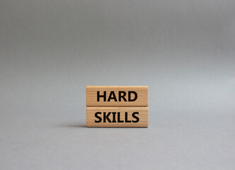 Hard skills symbol. Wooden blocks with words Hard skills. Beautiful grey background. Businessman hand. Business and Hard skills concept. Copy space