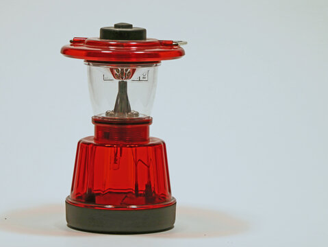 Small Red Lantern Against A White Background