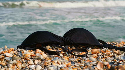 Concept of heatwave during the summer at sea. Warm sunny day in the summer. Nudist beach, clothes...