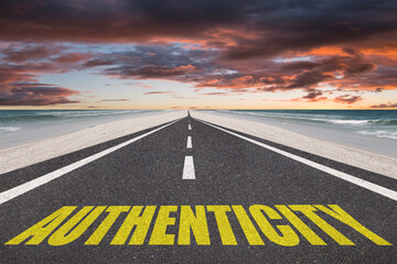 Authenticity word for genuine concept written on a highway in nature.