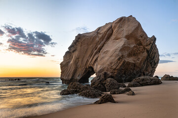 Fototapeta na wymiar Rock at sunset by the sea