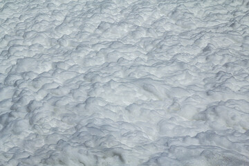 Background in the form of a large surface filled with white foam.