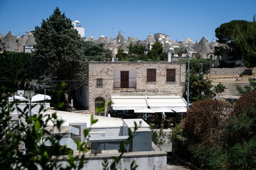 Street scene from the famous little town of Alberobello, one of the most touristic cities in Italy