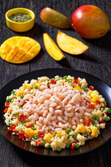 shrimps and millet pilaf with mango and veggies