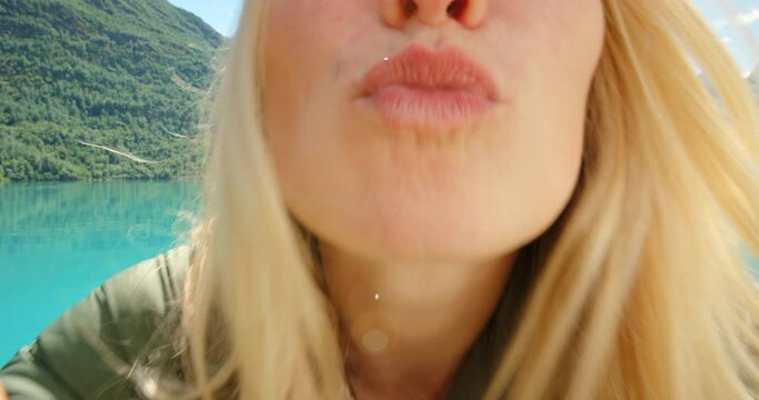 4k video footage of an attractive young woman recording a video during her hike of Sogn og Fjordane