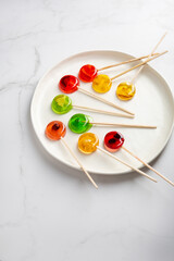 Fototapeta na wymiar Close up of mealting homemade candy lollipop