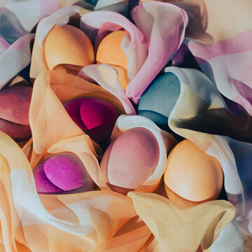 Eggs on a silk scarf  wallpaper. Flat lay concept.