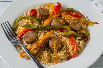 brown rice served  with peppers onions and sausage